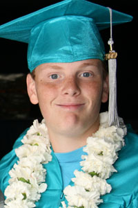 Boy in cap and gown.