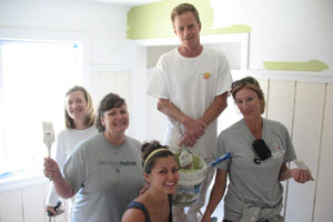 Group of youth painting a house.